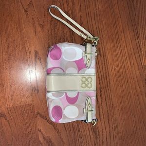 Pink and nude Coach clutch wristlet
